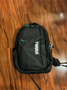 Thule Black Backpack with Teal Zipper Accents